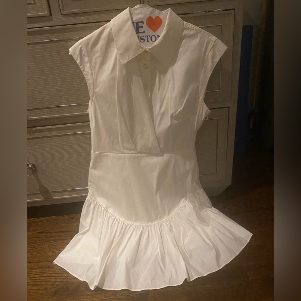 Milly white pleated bottom dress in white with gold detail buttons.